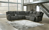 Bay Furniture Gallery - Ashley Furniture - Nettington Sectional - 4-Piece Power Reclining Sectional / Smoke - 44101S3